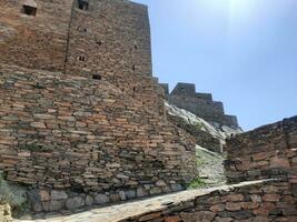 Al Bahah, Saudi Arabia, Sep 2023 - Beautiful daytime view of the historical ruins of Thee Ain Zee Ain or Dhee Ain  Ancient Village in Al Bahah, Saudi Arabia. photo