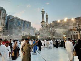 Mecca, Saudi Arabia, Sep 2023 - At Masjid Al Haram, Mecca, pilgrims from all over the world gather in the outer courtyard of Masjid Al Haram for Maghrib prayers. photo