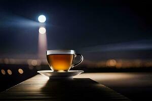 a cup of tea sits on a table in front of a city at night. AI-Generated photo