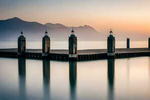 a pier in the water with mountains in the background. AI-Generated photo