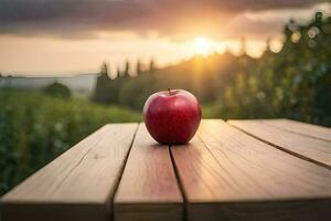 un manzana se sienta en un de madera mesa en frente de un puesta de sol. generado por ai foto