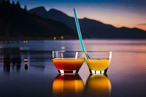 two glasses of orange juice with a straw sitting on the edge of a lake. AI-Generated photo