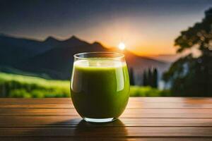 un vaso de verde jugo en un mesa en frente de un montaña. generado por ai foto