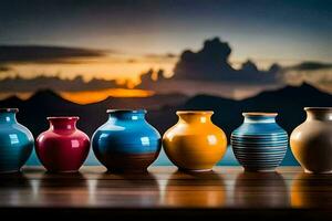 five colorful vases are lined up on a table. AI-Generated photo