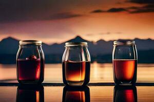 three jars of liquid sitting on a table with mountains in the background. AI-Generated photo