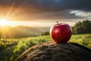 un manzana se sienta en parte superior de un rock en frente de un puesta de sol. generado por ai foto