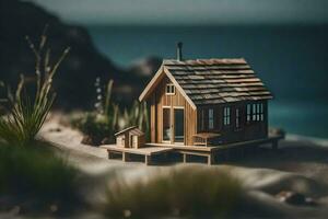 a miniature house on the beach with grass and sand. AI-Generated photo