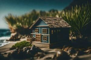 a miniature house on the beach with grass and rocks. AI-Generated photo