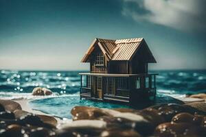 a miniature house on the beach by the ocean. AI-Generated photo