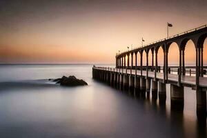 un largo exposición fotografía de un muelle a puesta de sol. generado por ai foto