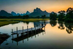 a man stands on a wooden pier in front of mountains. AI-Generated photo