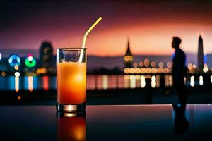 a glass of orange juice with a straw sitting on a table in front of a city skyline. AI-Generated photo