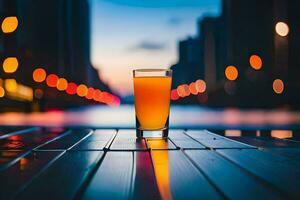 a glass of orange juice on a table in front of a city. AI-Generated photo