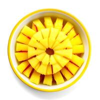 pineapple slices in a bowl on a white background. top view photo