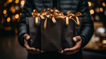 Close-up of male hands holding christmas gift boxes with gold ribbons. AI Generative photo