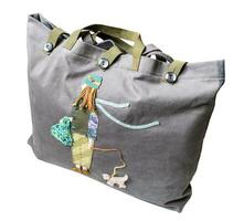 full closed gray fabric tote bag with applique photo