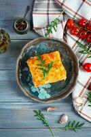 Meat lasagna with bolognese sauce and bechamel sauce. Classic lasagna. Top view photo