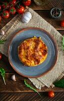 Classic lasagna with minced chiken bolognese sauce and bechamel sauce. Top view photo