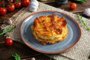 Classic lasagna with minced chiken bolognese sauce and bechamel sauce photo