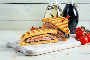 Club sandwich with ham, tomato and cheese. Grilled sandwich photo