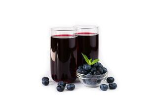 Fresh natural blueberry juice in glasses isolated on white background. Close-up. Copy space. photo