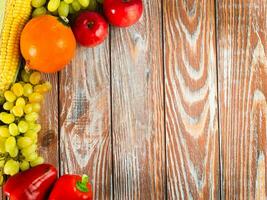 Organic, natural vegetables and fruits on a wooden background. Autumn background. Flatlay composition. Top view. Place for your text. photo