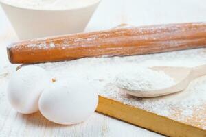 Baking ingredients on white wooden background photo