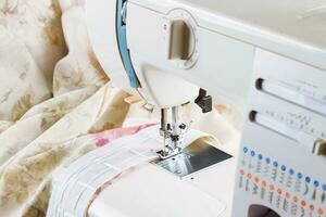 Modern sewing machine, sewing process photo