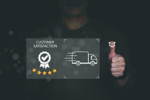 Satisfaction survey and customer service concept, businessman using smartphones To answer questionnaires about shipping services And give satisfaction ratings, give five-star satisfaction ratings. photo