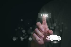 planning and strategy progress or success Man's hand choosing free shipping process that he is shopping online Display as a virtual hologram, online trading, information search, and online marketing photo