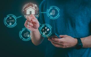 Man using a smartphone, controlling an intelligent home automation system Futuristic interface on a virtual screen Automation technology of things, concept Data connection with technology internet. photo