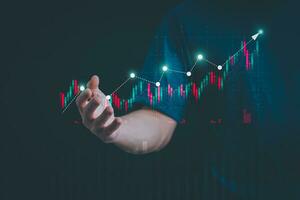 Planning and strategy, stock market, business growth, progress or success concept, businessman or trader showing growing virtual holographic stocks, invest in stock market trading or digital assets photo