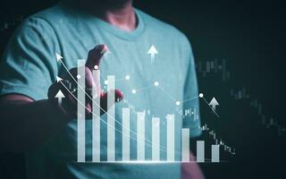 Planning and strategy, stock market, business growth, progress or success concept, businessman or trader showing growing virtual holographic stocks, invest in stock market trading or digital assets photo