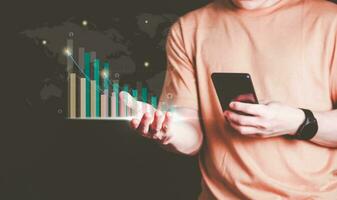 Planning and strategy, stock market, business growth, progress or success concept, businessman or trader showing growing virtual holographic stocks, invest in stock market trading or digital assets photo