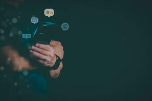 The concept of using digital media, technology, and social media. Surfing online, male hand using smartphone To chat or use social media, remote work concept, work from home via the Internet photo