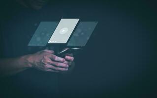 The man using smartphones, watching videos and studying online courses With the internet, the concept of global data connection with technology internet, big data, information search, online marketing photo