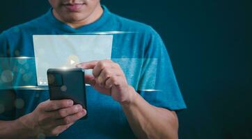 The man using smartphones, watching videos and studying online courses With the internet, the concept of global data connection with technology internet, big data, information search, online marketing photo