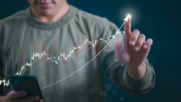 Planning and strategy, stock market, business growth, progress or success concept, businessman or trader showing growing virtual holographic stocks, invest in stock market trading or digital assets photo