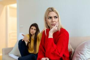 Woman apologizes to her friend after fight. Repentant woman hope for forgiveness from sad pensive friend. Family on verge of divorce. Couple treason problem concept photo