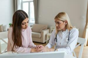 Healthcare and medical concept - doctor with patient in hospital. Doctor working in the office and listening to the patient, she is explaining her symptoms, healtcare and assistance concept photo