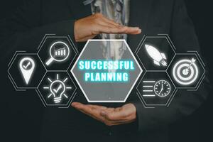 Successful planning concept, Businesswoman hand holding successful planning icon on virtual screen. photo