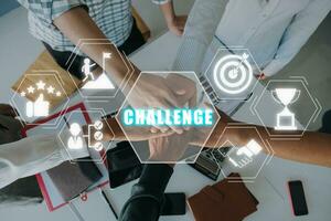 Challenge concept, Happy business team celebrating victory in office with challenge icon on virtual screen. photo