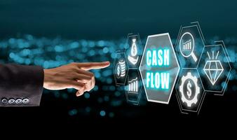 Cash flow concept, Business person hand select cash flow icon on virtual screen. photo
