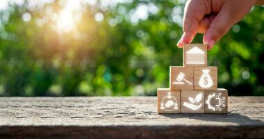 Pestel concept, Man hand holding wooden block with pestel icon on virtual screen. photo