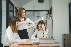 Serious business team leader coach mentor talk to diverse business people in office explain strategy at corporate group meeting, multiethnic staff listen to boss instruct interns at briefing photo