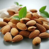 Sweet brown almonds on a white background photo