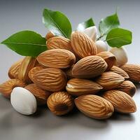 Sweet brown almonds on a white background photo