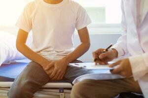 doctor is having consultation discussing prostate cancer and venereal cancer detected in young man. Current doctors provide advice and counseling on detecting prostate cancer and treating it properly. photo