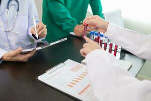 The doctor joins a meeting with the surgeon's team to discuss a plan for cancer surgery after the medical team detects cancer. Collaborative concept of a team doctors and surgeons in surgery. photo