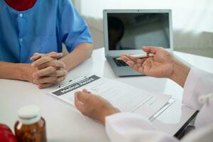 A heart patient visits a medical for advice on health care and medication to treat heart disease symptoms after the medical team has diagnosed and examined the patient for heart abnormalities. photo